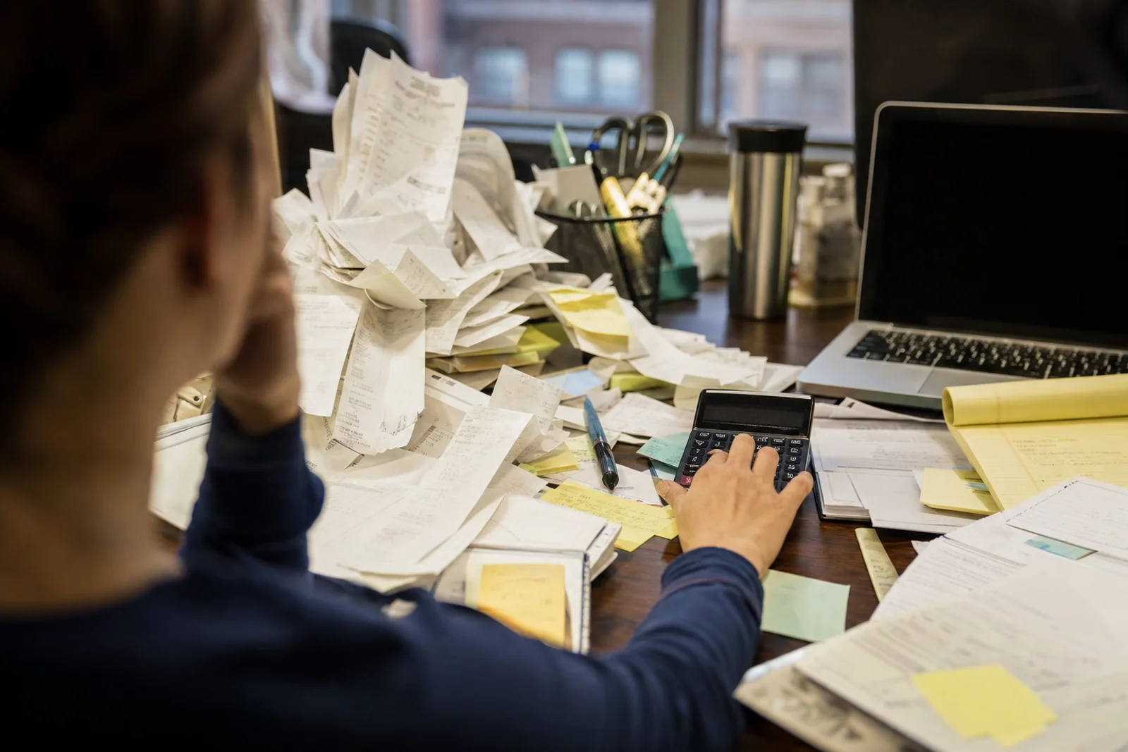 Overwhelmed business owner managing bookkeeping without CPA guidance in Fort Wayne